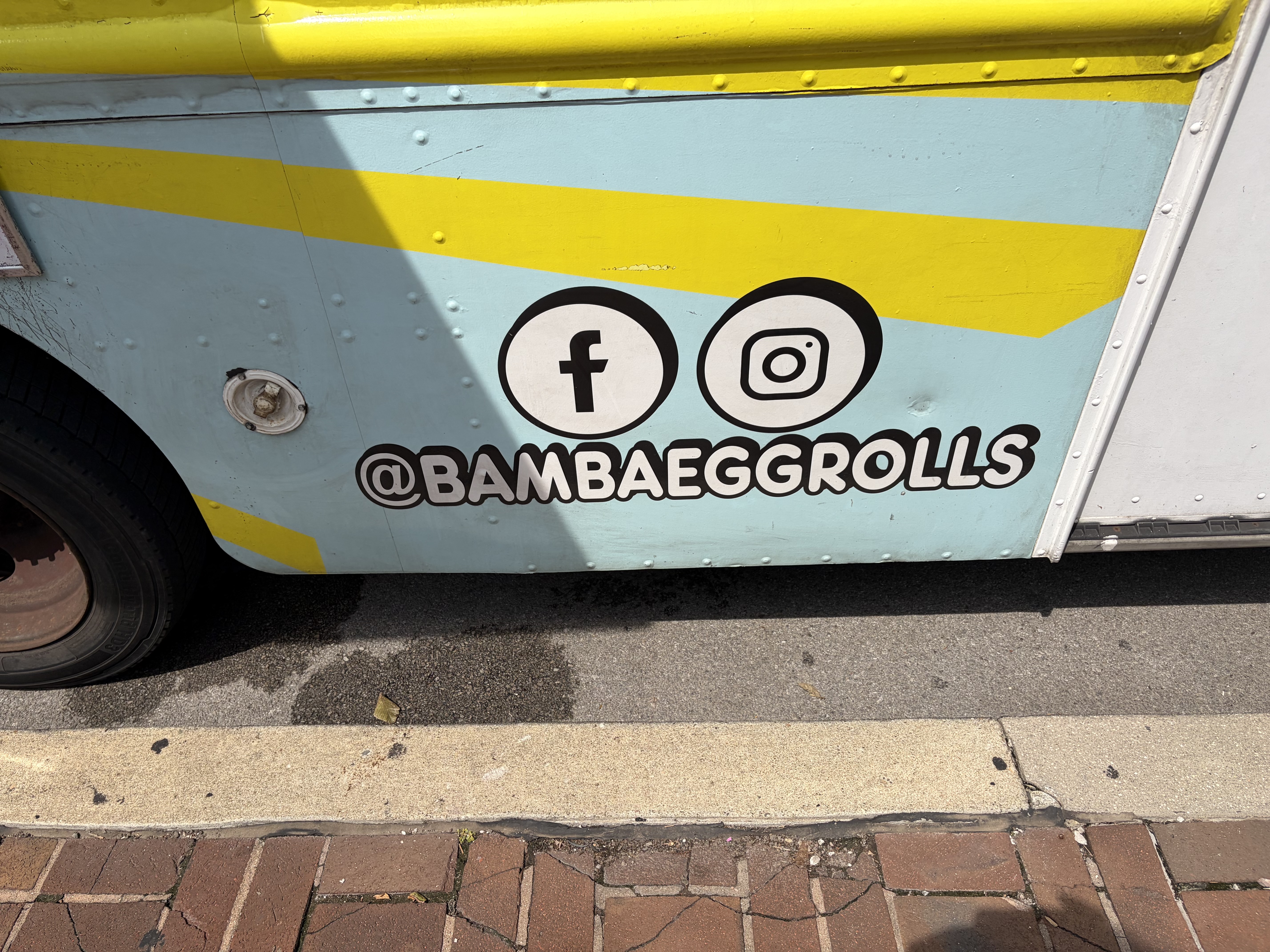 The yellow-and-blue Bamba Egg Rolls Filipino food truck